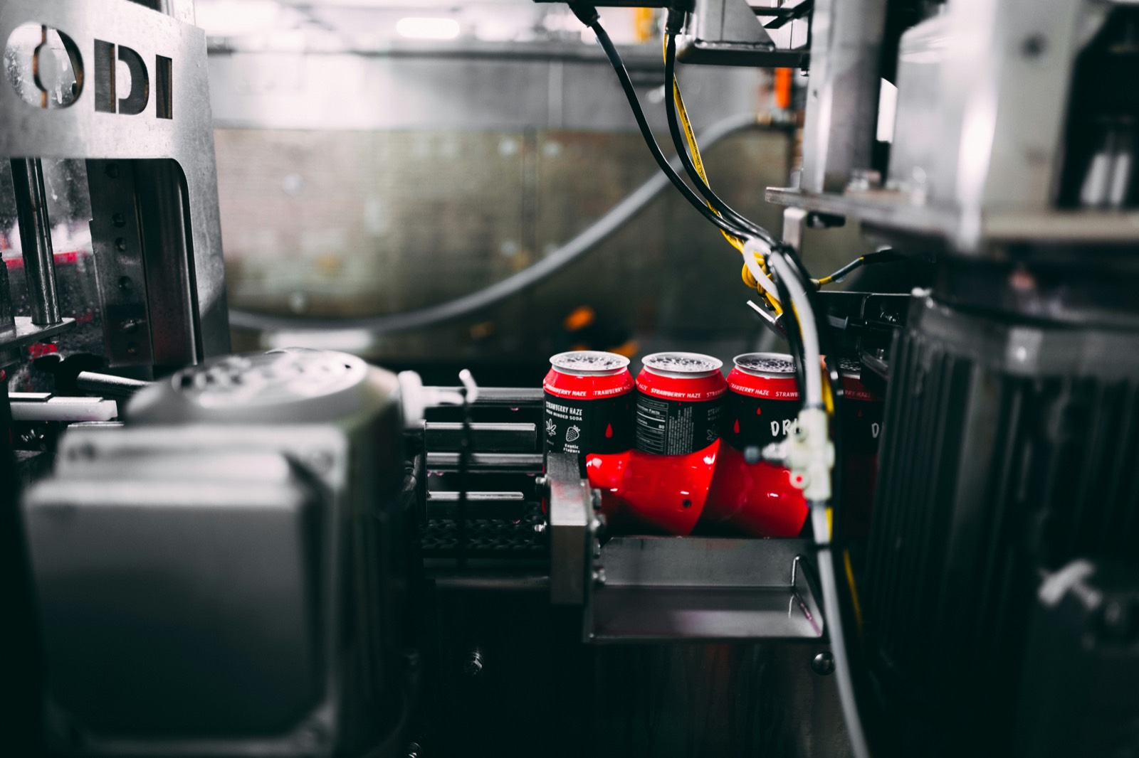 Aluminium cans moving along the canning line